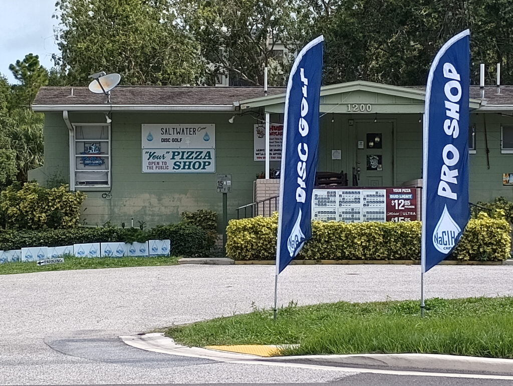 Feather flags outside a disc golf pro shop