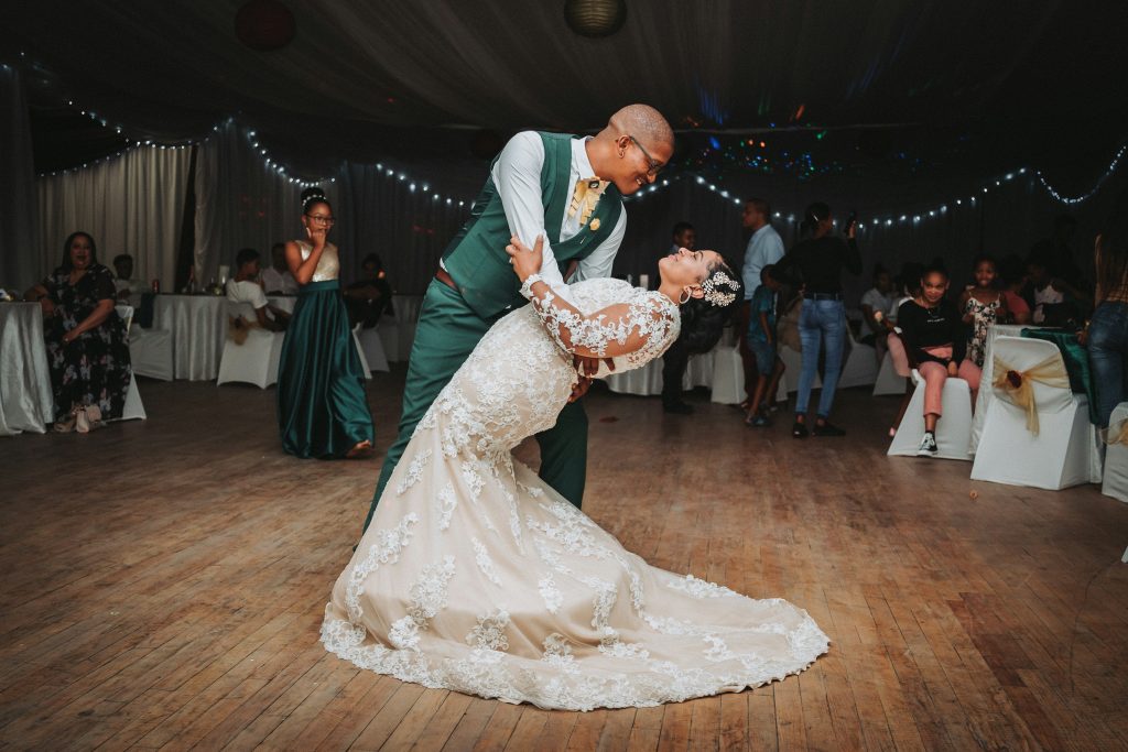 Man dipping wife at wedding