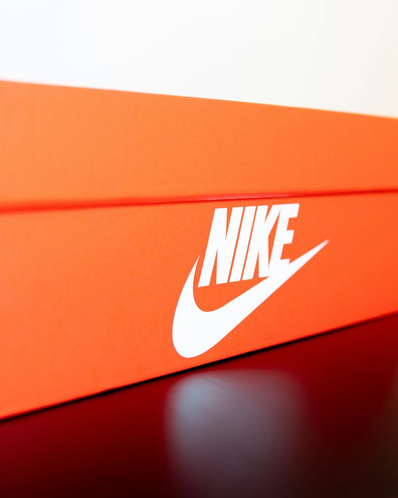 the nike logo on an orange background