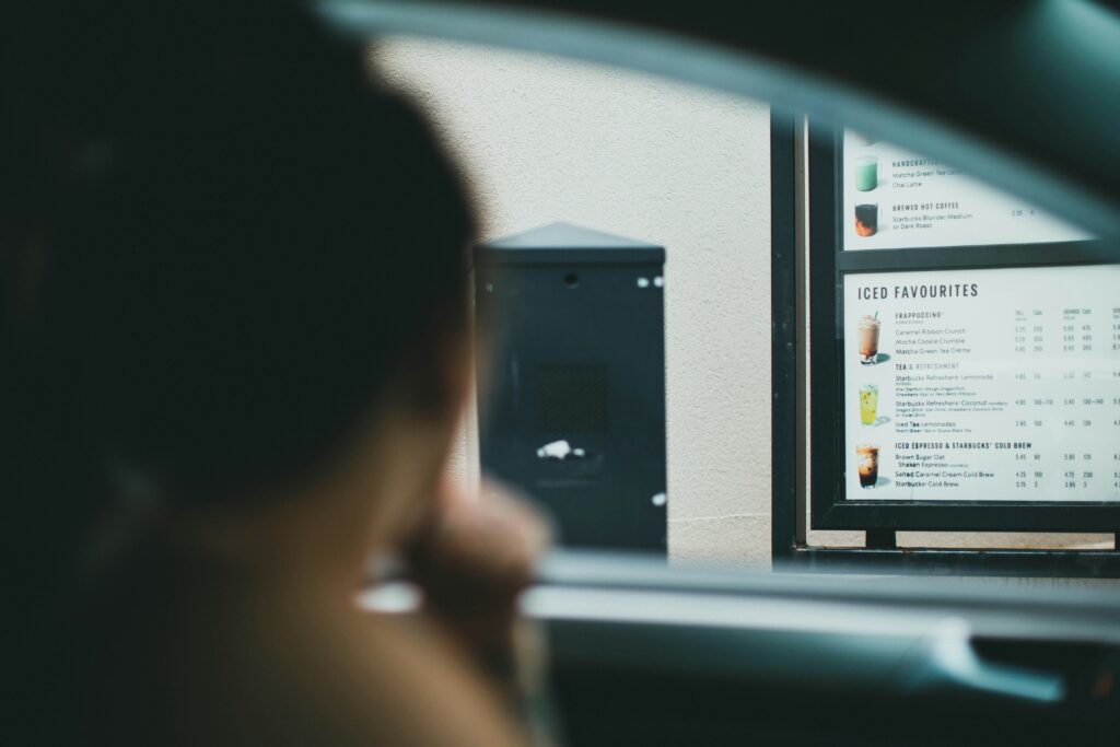 Marketing Ideas for Fast Food Restaurants to Attract More Customers 3 Person sitting at drive thru