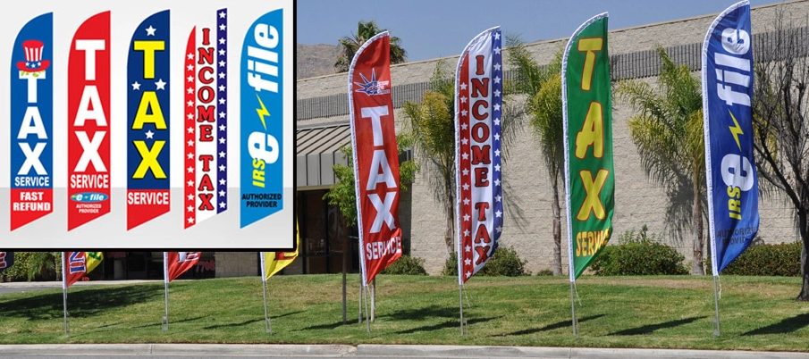 a selection of Tax feather flags outside.